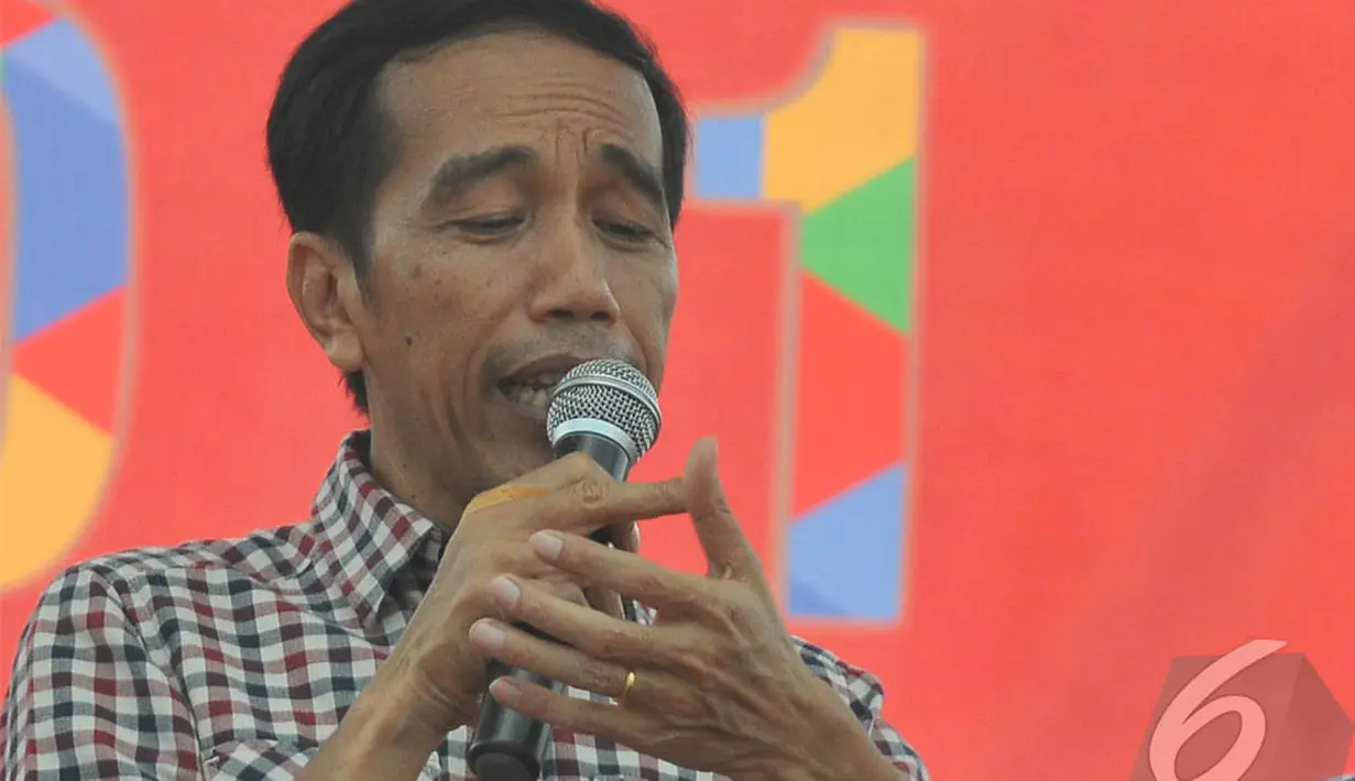 Jokowi  mengingatkan warga agar tidak mudah terpengaruh atau pun ikut terlibat dengan politik uang (money politics) , Madiun, Jawa Timur, Sabtu (28/6/2014) (Liputan6.com/Herman Zakharia)