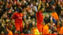 Mamadou Sakho dan Dejan Lovren melakukan selebrasi usai pertandingan melawan Dortmund di leg kedua Liga Europa di stadion Anfield, Inggris, (15/4). Liverpool ke semifinal usai mengalahkan Dortmund dengan agregat 5-4. (Reuters/Darren Staples)