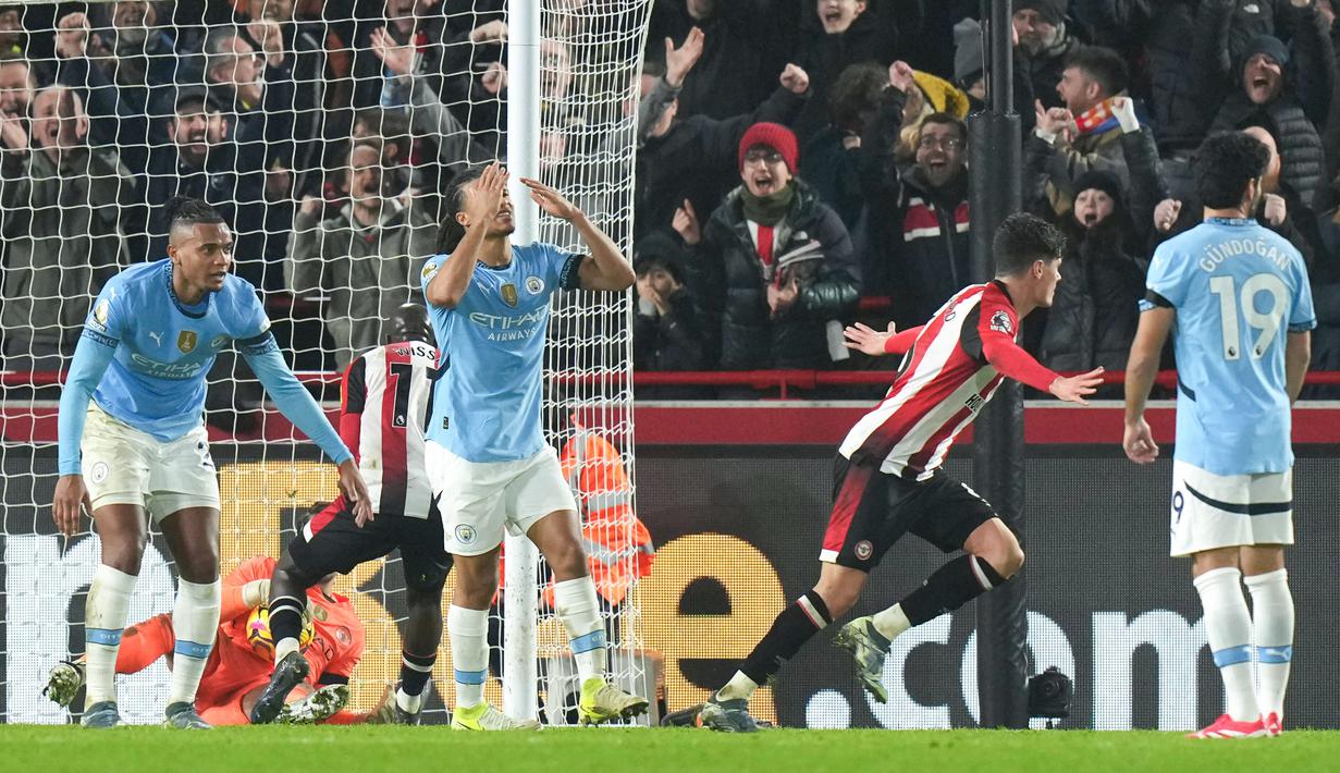 Namun, Brentford pantang menyerah dan sukses mengejar ketinggalan lewat gol Yoane Wissa dan Christian Norgaard. (AP Photo/Alastair Grant)