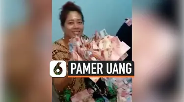 Viral di media sosial, sepasang suami istri yang memamerkan tumpukan uang di dalam kamar. Belum diketahui identitas dan lokasi ini terjadi.