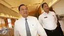Gubernur Bank Indonesia Agus Martowardojo (kiri) dan Kepala BNN Budi Waseso (kanan) berjalan bersama usai menandatangani nota kesepahaman antara Bank Indonesia dan Badan Narkotika Nasional di Jakarta, Senin (15/8). (Liputan6.com/Immanuel Antonius)