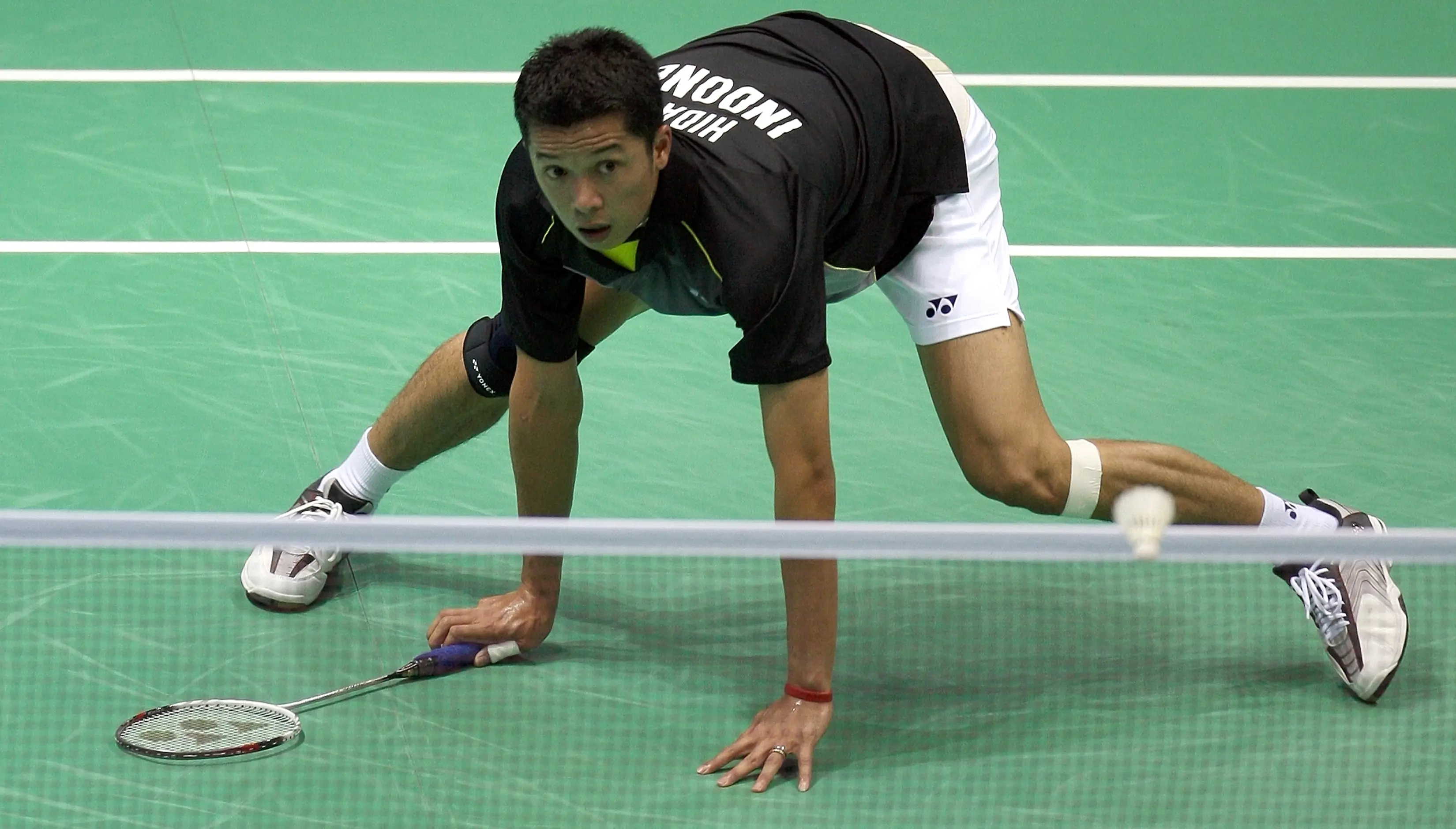 Taufik Hidayat saat tampil pada Plimpiade Beijing  2008. (AFP /Indranil Mukherjee)