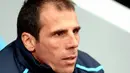 West Ham Manager Gianfranco Zola watches players warm up ahead of a Premiership match against Portsmouth at Boleyn Ground, London, on November 15, 2008. AFP PHOTO/Leon Neal