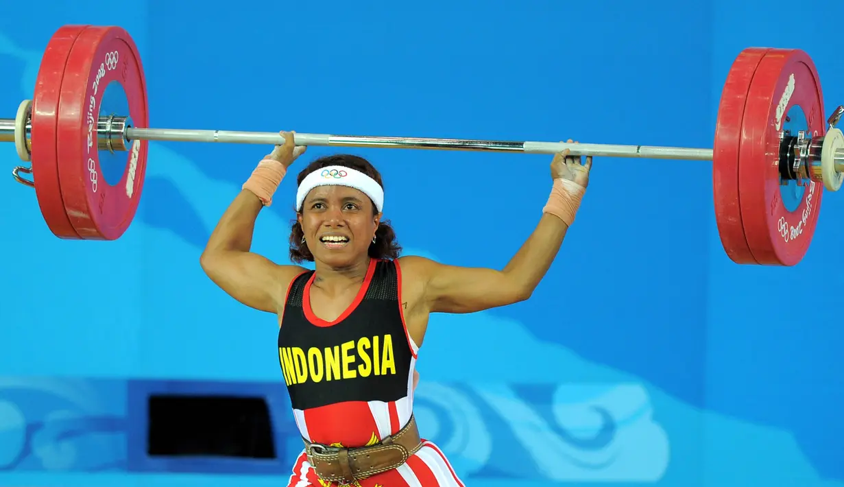 <p>4. Lisa Raema Rumbewas (angkat Besi Putri 48 Kilogram) - Meraih medali perunggu Asian Games 2002. (AFP/Jung Yeon-Je)</p>