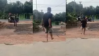 Tangkapan layar video viral yang memperlihatkan aksi duel menggunakan senjata tajam jenis pedang di Kabupaten Lampung Timur. (Liputan6.com/Istimewa).