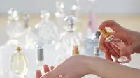 Spray Perfume on Wrist
