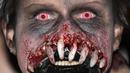 Seseorang yang mengenakan kostum menakutkan berpartisipasi dalam Zombie Walk dan Parade Halloween tahunan di Essen, Jerman, Minggu (31/10/2021). Setiap 31 Oktober sebagian masyarakat dunia ikut memeriahkan perayaan Halloween. (AP Photo/Martin Meissner)