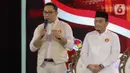 Pasangan calon gubernur dan wakil gubernur DKI Jakarta nomor urut 1, Ridwan Kamil-Suswono saat menyampaikan visi misi dalam segmen pertama pada debat perdana calon gubernur dan wakil gubernur DKI Jakarta di JIExpo, Kemayoran, Jakarta Pusat, Minggu (6/10/2024). (Liputan6.com/Herman Zakharia)