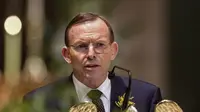 Kamis (7/8/14), PM Australia Tony Abbott saat memberikan sambutan di acara hari berkabung nasional untuk mengenang korban tewas MH17 di Ukraina. (REUTERS/Mark Dadswell)