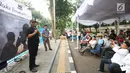 Ketua DPRD DKI Jakarta Prasetyo Edi Marsudi memberi sambutan saat menghadiri buka puasa bersama Pewarta Foto Indonesia Jakarta (PFIJ) di kawasan Bundaran HI, Jakarta, Jumat (18/5/2019). Buka puasa bersama ini dihadiri ratusan pewarta foto dari berbagai media massa. (Liputan6.com/Herman Zakharia)