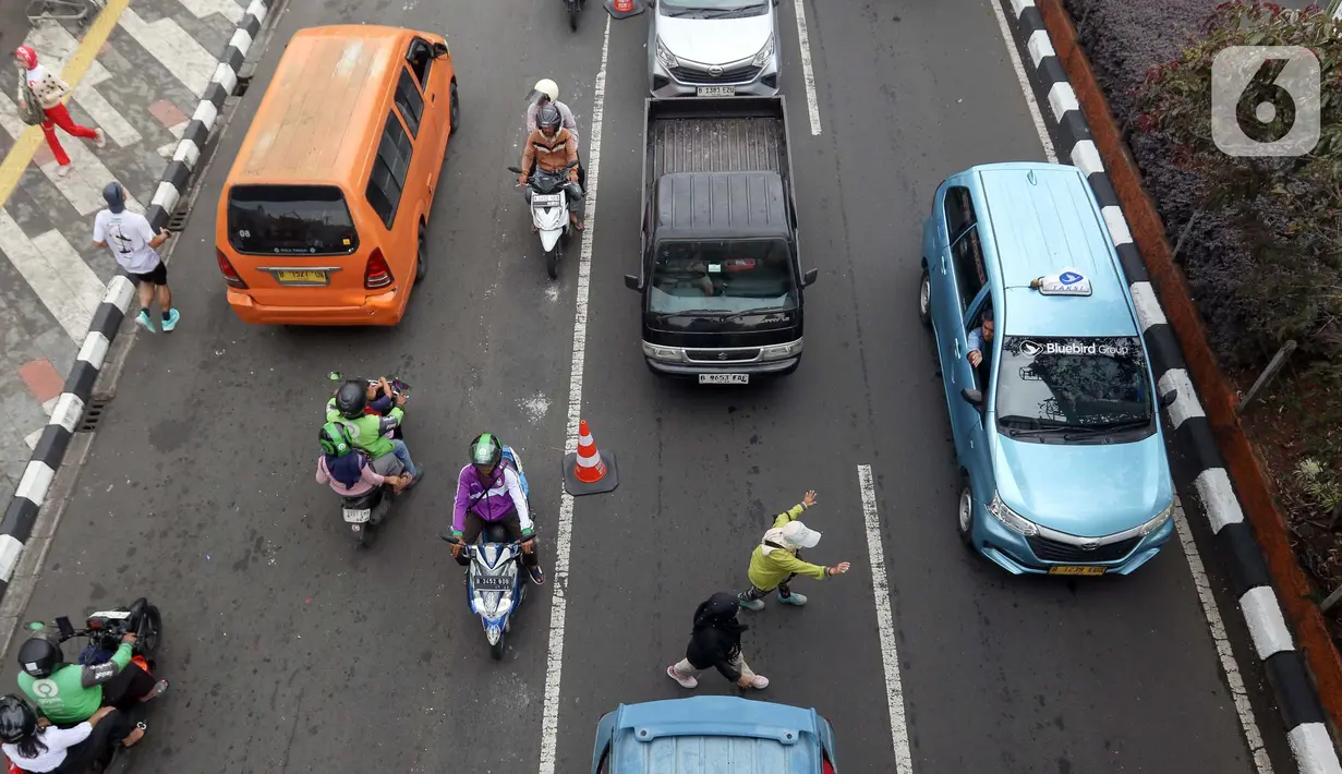 Penerapan sistem ini untuk mendukung pelaksanaan Hari Bebas Kendaraan Bermotor atau Car Free Day (CFD) di kota Depok, Jawa Barat. (Liputan6.com/Herman Zakharia)