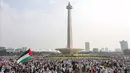 Ribuan warga mengikuti aksi damai Bela Palestina di kawasan Monas, Jakarta, Minggu (5/11/2023). (Liputan6.com/Faizal Fanani)