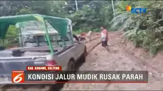 Untuk bisa tembus melintas di jalan ini, warga bersama para sopir saling bergotong-royong mengguanakan tali tambang menarik mobil.