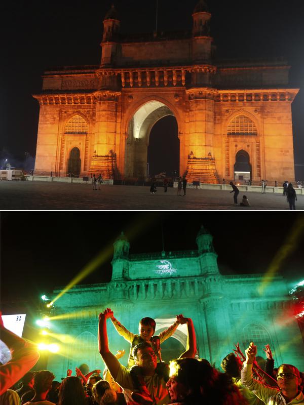 Foto kombinasi menunjukkan segelintir orang di depan Gerbang India yang ikonik, atas, tempat populer untuk merayakan Malam Tahun Baru di Mumbai, India, Kamis, 31 Desember 2020, dibandingkan dengan file foto kerumunan yang merayakan pada 31 Desember 2019. (AP Photo/Rafiq Maqbool, Rajanish Kakade)