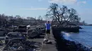 Bencana kebakaran hebat ini terjadi setelah tengah malam pada Selasa (8/8). Kala itu, kebakaran sebuah semak dilaporkan terjadi di kota Kula, 56 kilometer dari Lahaina. Lima jam kemudian, warga Lahaina mengeluhkan listrik padam. (AP Photo/Rick Bowmer)