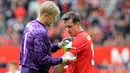 Gary Neville (kanan) merupakan penerus Roy Kane sebagai kapten Manchester United. Selama masa jabatannya, pemain asal Inggris tersebut berhasil mempersembahkan dua gelar Liga Champions dan satu trofi Liga Champions. (AFP/Lindsey Parnaby)