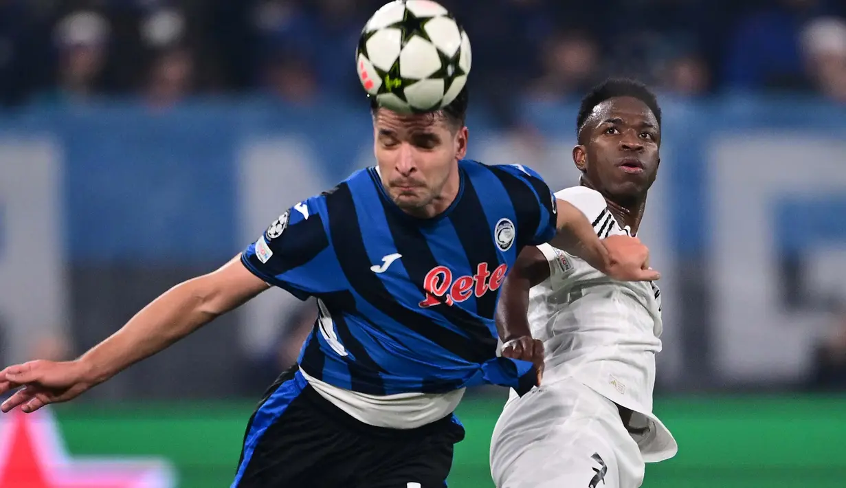 Di menit ke-56, Vinicius Junior berhasil mencetak gol kemenangan untuk Real Madrid. (Marco BERTORELLO/AFP)