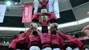 Kompetisi ini melibatkan sekitar 30 grup yang masing-masing grup bisa berisi dari 400 orang, Spanyol, Sabtu (1/10). Kelompok yang bisa membangun menara tertinggi, merekalah yang akan jadi pemenang. (AFP PHOTO / Lluis Gene)