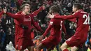 Para pemain Liverpool merayakan gol yang dicetak Xherdan Shaqiri ke gawang Manchester United pada laga Premier League di Stadion Anfield, Liverpool, Minggu (16/12). Liverpool menang 3-1 atas MU. (AFP/Paul Ellis)