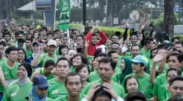 15 ribu pelari dari dalam maupun luar negeri meramaikan  lomba lari 'Milo Jakarta International 10K' di kawasan Kuningan, Jakarta, Minggu (24/7). Lomba lari itu digelar untuk memperingati hari ulang tahun DKI Jakarta ke-489. (Liputan6.com/Yoppy Renato)