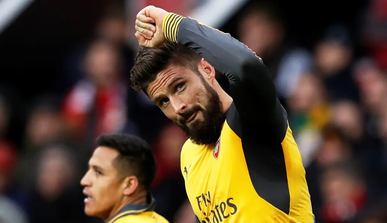 Ekspresi striker Arsenal, Olivier Giroud, setelah mencetak gol balasan di menit ke-89 ke gawang MU dalam laga Premier League di Stadion Old Trafford, Sabtu (19/11/2016). (Reuters/Phil Noble)