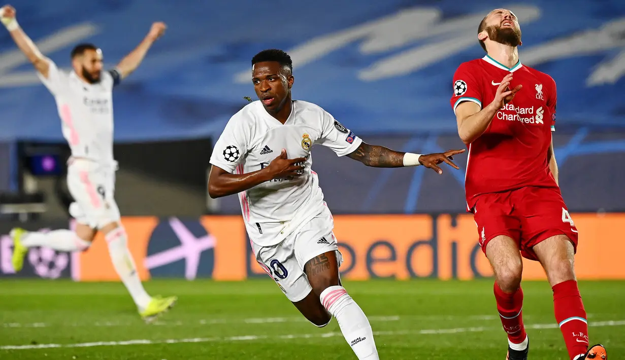 Penyerang muda asal Brasil, Vinicius Junior, memborong dua gol ke gawang Liverpool pada laga Leg pertama Liga Champions. Gol tersebut dicetak pada menit ke-27 dan Menit ke-65. (AFP/Gabriel Bouys)