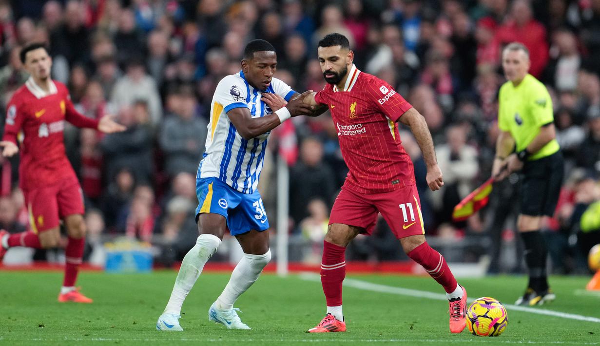 Kemenangan ini membawa Liverpool memimpin klasemen dengan 25 poin, unggul dua poin atas sang juara bertahan City. Sementara Brighton turun ke posisi ketujuh setelah kekalahan pertama mereka dalam empat laga terakhir di Premier League. (AP Photo/Jon Super)