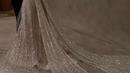 Detail ekor panjang dan manik-manik yang menghiasi seluruh permukaan gaun membuat Chelsea Islan terlihat semakin mewah dan elegan. Ditambah aksesori berupa anting dan kalung warna senada dengan gaunnya.@lxemoments.