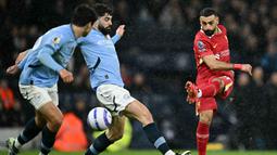 Winger asal Mesir itu tampil fantastis dengan kontribusi satu gol dan satu assist. (AFP/Paul Ellis)