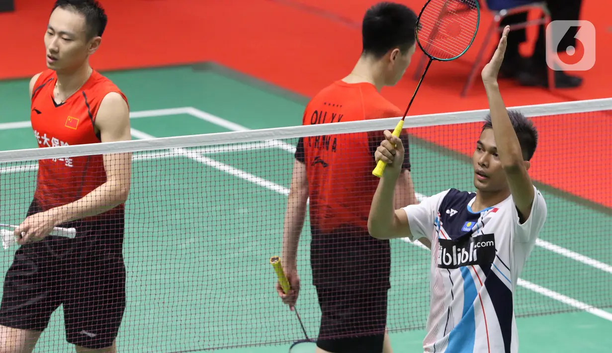 Pebulutangkis Indonesia, Muhammad Rian Ardianto berselebrasi usai melawan Qu Xuan Yi/Zhang Nan (China) pada babak kedua ganda putra Indonesia Masters 2020 di Istora GBK, Jakarta, Kamis (16/1/2020). Fajar/Rian unggul 21-10 12-21 21-19. (Liputan6.com/Helmi Fithriansyah)