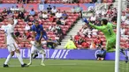 Kiper Timnas Rumania, Florin Nita gawangnya dari sundulan penyerang Timnas Inggris, Dominic Kalvert-Lewin pada laga pemanasan jelang Piala Eropa 2020 di Riverside Stadium, Minggu (6/6/2021). Bertanding menghadapi Rumania, Inggris menang tipis 1-0. (Paul Ellis, Pool via AP)