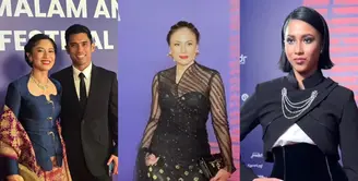 Dian Sastro menunjukkan pesona elegan dalam balutan kebaya modern berwarna navy yang dipadukan dengan songket nuansa merah dari Hian Tjen. [@therealdisastr].