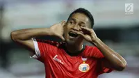 Pemain Persija, Ramdani Lestaluhu merayakan gol keduanya ke gawang Bhayangkara FC pada laga penutup Liga 1 Indonesia di Stadion Patriot Candrabhaga, Bekasi, Minggu (12/11). Persija unggul 2-1. (Liputan6.com/Helmi Fithriansyah)