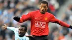 Manchester United's defender Patrice Evra (R) vies with Manchester City's midfielder Shaun Wright-Phillips during the EPL match at The City of Manchester Stadium on November 30 , 2008. AFP PHOTO/ANDREW YATES.