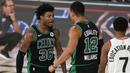 Pebasket Boston Celtics, Marcus Smart, melakukan selebrasi bersama Grant Williams saat melawan Toronto Raptors pada semifinal playoff Wilayah Timur NBA, Rabu (2/9/2020). Celtics menang dengan skor 102-99. (AP Photo/Mark J. Terrill)