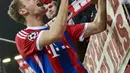 Terlihat kharisma Thomas Mueller (GUENTER SCHIFFMANN / AFP )