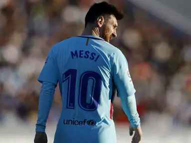 Bintang Barcelona, Lionel Messi memimpin top scorer sementara La Liga Santander dengan koleksi 12 gol hingga pekan ke-12.  (AP/Francisco Seco)