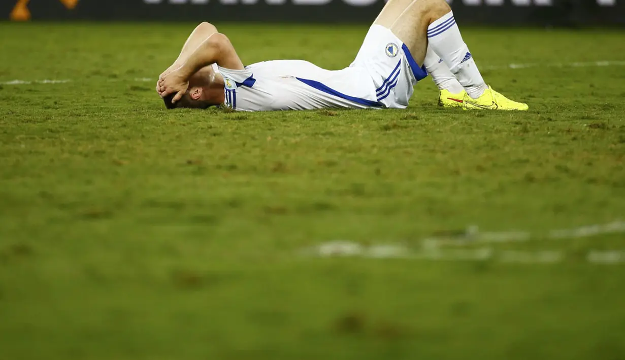 Ekspresi kekecewaan pemain belakang Bosnia, Toni Sunjic, saat dikalahkan Ghana 1-0 di laga penyisihan Piala Dunia 2014 Grup F di Stadion Pantanal, Cuiaba, Brasil, (22/6/2014). (REUTERS/Michael Dalder)