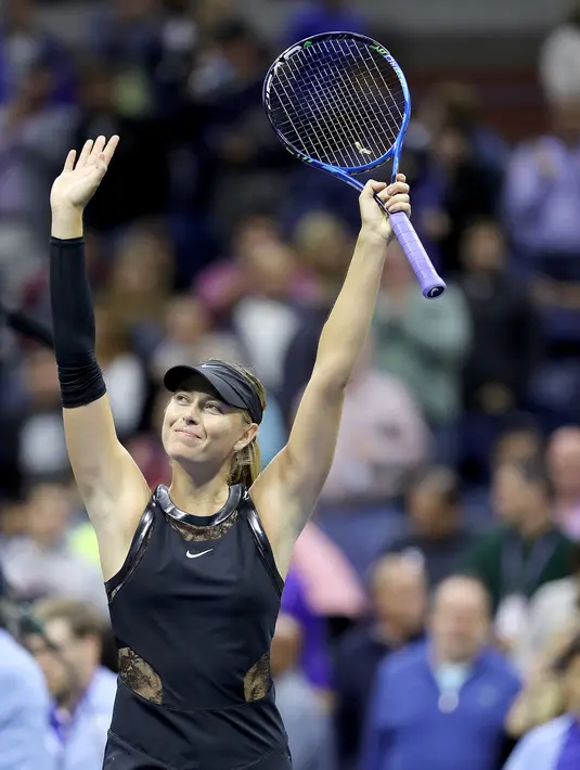 Ekspresi Maria Sharapova usai mengalahkan petenis Sofia Kenin dari AS saat pertandingan Tunggal Wanita Terbuka 2017 di ASTA Billie Jean King National Tennis Center di New York (1/9). Sharapova menang 7-5 6-2. (AFP Photo/Jewel Samad)