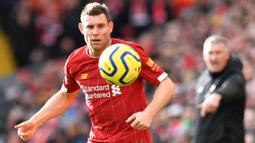 James Milner bergabung dengan The Reds dengan status bebas transfer pada 2015. Sejauh ini, ia telah membuat 280 penampilan untuk Liverpool dengan mencetak 26 gol. Kemampuannya untuk bermain di hampir semua posisi telah menyelamatkan klub selama krisis cedera. (AFP/Paul Ellis)