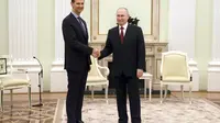 Presiden Suriah Bashar Al-Assad saat bertemu Presiden Vladimir Putin di Moskow, Rusia, pada Rabu (15/3/2023). (Dok.&nbsp;Kremlin via AP)