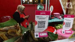 Bank Indonesia  (BI) telah memutuskan transaksi QRIS di bawah Rp 100 ribu tidak akan terkena biaya per 1 September 2023. (Liputan6.com/Angga Yuniar)