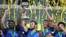 Gelandang Prancis Lucas Tousart memegang trofi saat merayakan dengan rekan setim usai memenangkan Piala Eropa 2016 U-19, Jerman, Minggu (24/7). Di final Prancis menang 4-0 dari Italia.(AFP PHOTO/Daniel Roland) 