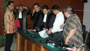 Didik Purnomo bersama penasehat hukumnya usai menjalani sidang perdana di Pengadilan Tipikor, Jakarta, Kamis (11/12/2014). (Liputan6.com/Andrian M Tunay)