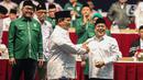Ketua Umum Partai Gerindra Prabowo Subianto bersalaman dengan Ketua Partai Kebangkitan Bangsa (PKB), Muhaimin Iskandar saat deklarasi koalisi antara Partai Gerindra dan Partai Kebangkitan Bangsa (PKB) dalam Rapimnas Gerindra di SICC, Sentul, Kabupaten Bogor, Jawa Barat, Sabtu (13/8/2022). Partai Gerindra dan PKB secara resmi menyatakan berkoalisi untuk pemilu 2024. (Liputan6.com/Faizal Fanani)