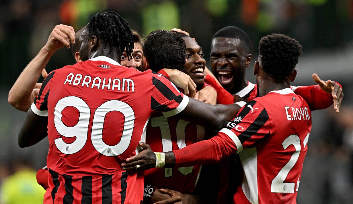 Skor 3-0 bertahan hingga laga usai. Kemenangan ini mengantar Rossoneri naik ke peringkat dua klasemen sementara dengan 11 poin. (Gabriel BOUYS/AFP)