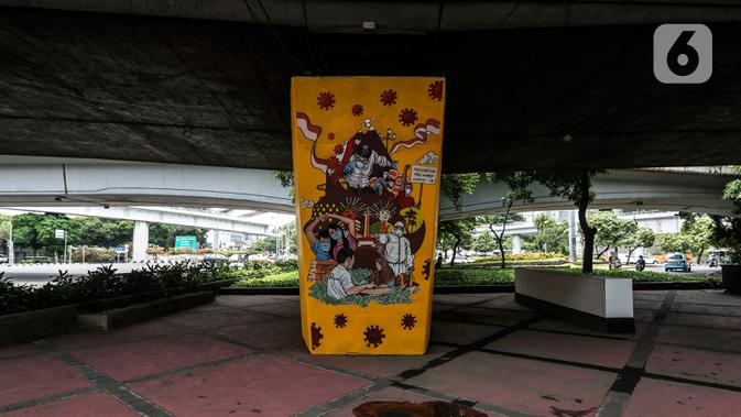 Mural imbauan untuk melawan COVID-19 terlihat di bawah kolong jembatan di Jakarta, Kamis (17/11/2020). Airlangga mengajak seluruh stakeholder maupun civitas akademi untuk bersama-sama mengendalikan penyebaran Covid-19. (Liputan6.com/JohanTallo)
