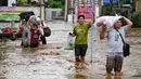 Cuaca buruk usai terjangan Topan Yagi berdampak pada ribuan warga di Thailand. (Lillian SUWANRUMPHA/AFP)