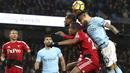 Aksi pemain Manchester City, Nicolas Otamendi menghalau bola dari dua pemain Watford pada lanjutan Premier League di Etihad stadium, Manchester, (2/1/2018).  City menang 3-1. (Martin Rickett/PA via AP)