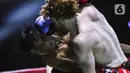 Bagi sebagian besar orang, olahraga tarung bebas atau sering disebut Mixed Martial Arts (MMA) adalah olah raga yang keras. Kini, olahraga tarung bebas semakin disukai di berbagai penjuru dunia tak terkecuali di Indonesia. (Liputan6.com/Faizal Fanani)